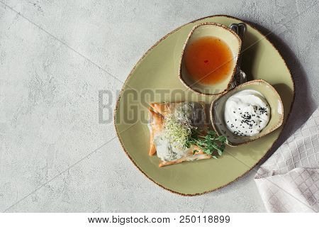 Flat Lay With Samosas In Phyllo Dough Stuffed With Spinach And Paneer Decorated With Germinated Seed
