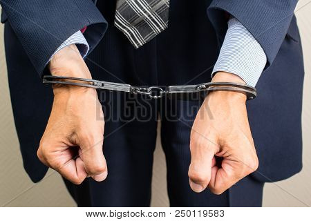 Arrested Businessman In Handcuffs. Businessman Bribetaker Or Briber. Concept Of Fraud, Detention, Cr