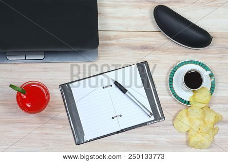 Designer Breakfast And Empty Notepad.  Cup Of Coffee, Juice, Crispy Potato Chips, Glasses Case, Note