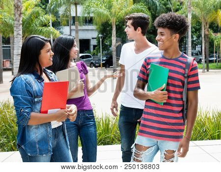 Goup Of Talking International Students Outdoor On Campus Of Unniversity