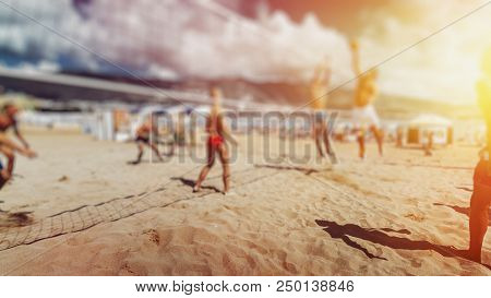 Young Tourists Enoys Summer And Playing Volleyball. Team Success Business Concept, Blured Image