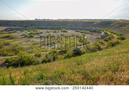 A Huge Quarry With An Abandoned Building. The Foundation Of A Large Structure.