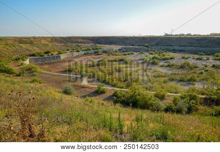 A Huge Quarry With An Abandoned Building. The Foundation Of A Large Structure.