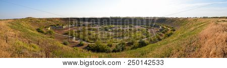 A Huge Quarry With An Abandoned Building. The Foundation Of A Large Structure.