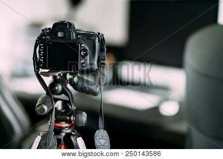 Professional Photographer Taking Interior Design Photos Using Professional Gear, Camera And Tripod