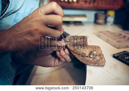 Different Goldsmiths Tools On The Jewelry Workplace. Jeweler At Work In Jewelry. Desktop For Craft J