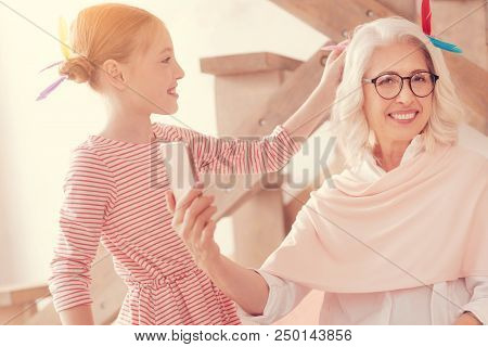 Future Great Hairdresser. Selective Focus On A Positive Minded Senior Woman Looking Into The Camera 