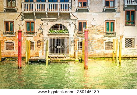 Traitional Venice House Door Way And Boat Embanlment Over Water Of Canal, Italy, Toned