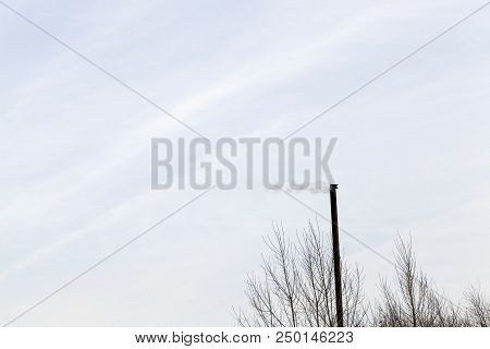A Thin Pipe From The Boiler-house From Which Smoke Is   During The Burning Of Fuel, Close-up In The 