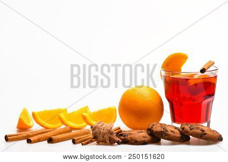 Drink Or Beverage With Orange And Cinnamon. Cocktail And Bar Concept. Glass With Mulled Wine Or Hot 