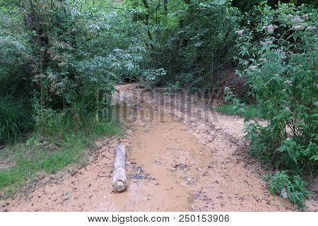 Rustrel, France - July 14, 2018: Photography Showing A Small Water Stream. The Photography Was Taken