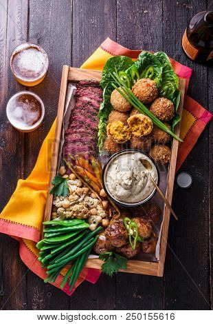 A Box With Falafel, Meat, Assorted Vegetables And Dip. Arabian Style. Top View.