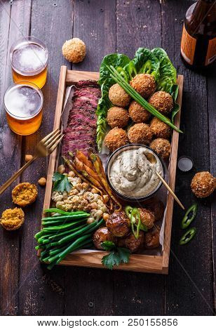 Arabian Style Dinner: Falafel, Beef, Babaghanoush, Bean, Green Peas And Roots Vegs Top View