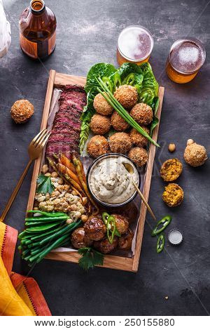 Arabian Style Dinner: Falafel, Beef, Babaghanoush, Bean, Green Peas And Roots Vegs Top View