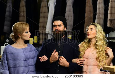 Friends In Shop: Ladies And Gentleman In Expensive Overcoats. Guy With Beard And Women In Furry Coat