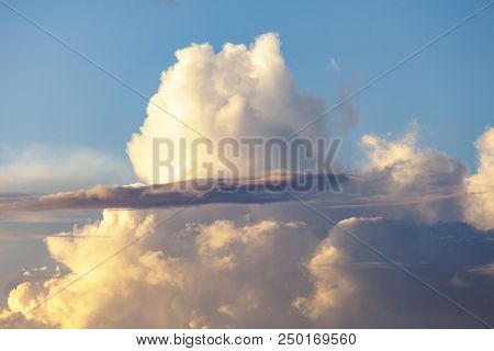 Heapy Clouds With Warm Sunset's Ray.