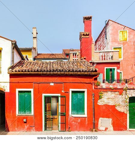 Rectilinear View Of The Colored Facades Of Buildings On The Island Of Burano, Near Venice, Italy