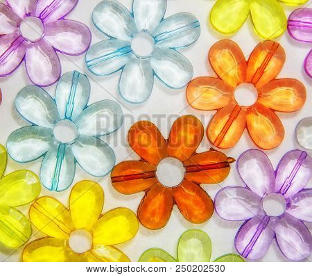 Colored Glass Transparent Flowers In A Colored Background On White