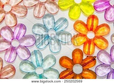 Colored Glass Transparent Flowers In A Colored Background On White