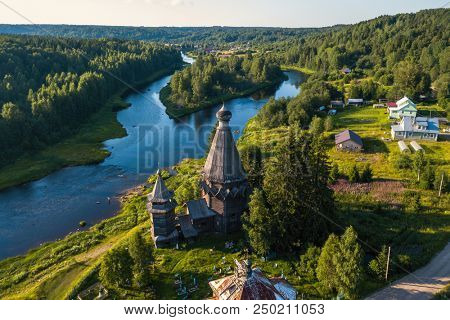 Top view of Vazhinka river and Church of St. Nicholas (built 1696) in Soginicy village, Leningrad region, Russia.