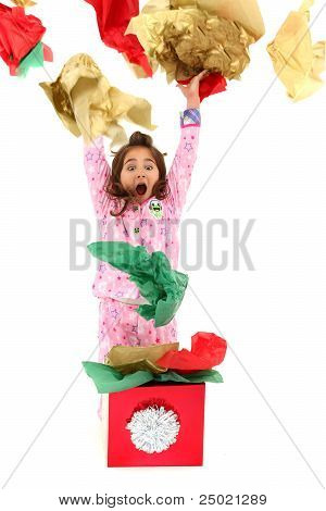 Excited Girl Child Throwing Wrapping Paper