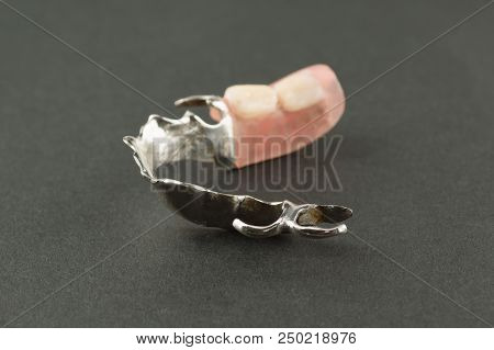 Large Image Of A Modern Denture On A Black Background