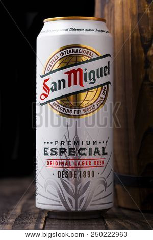 London, Uk - April 27, 2018: Aluminium Can Of San Miguel Lager Beer Next To Wooden Barrel. The San M