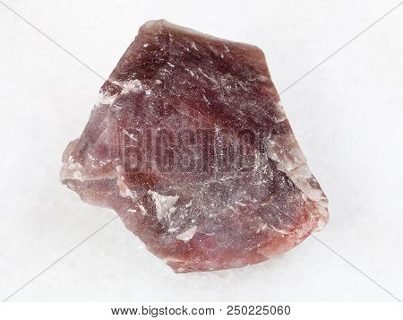 Macro Shooting Of Natural Mineral - Rough Pink Flint Stone (chalcedony) On White Marble From Ural Mo