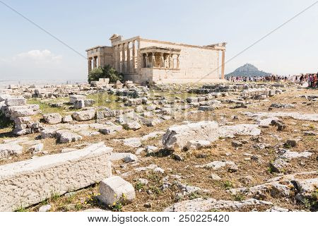 Athens, Greece - May 2018: Tourists Visiting The Ruins Of Old Temple Of Athena Polias Near Parthenon