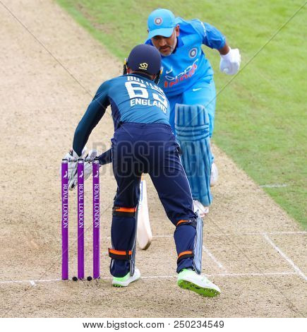 LEEDS, ENGLAND - JULY 17: Jos Buttler and MS Dhoni during the 3rd Royal London One day International match between England and India at Headingley Cricket Ground on July 17, 2018 in  England.  