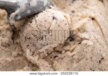 Vanilla Ice Cream Scoop, Scooped Out Of A Container With A Utensil