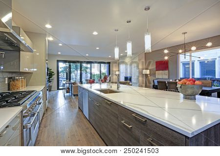 Sleek Modern Kitchen Design With A Long Center Island.