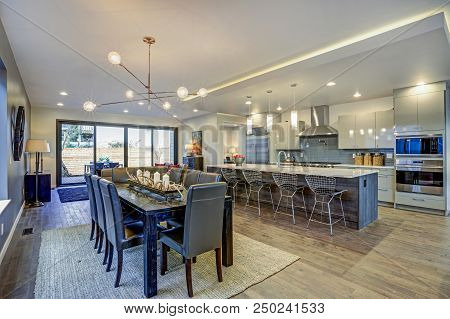 Sleek Modern Kitchen Design With A Long Center Island.