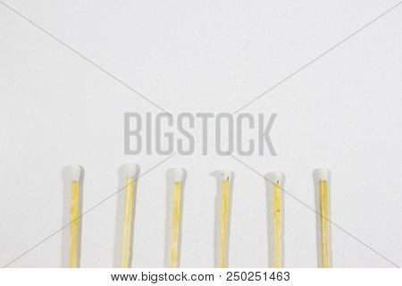 Upper Close-up Half Shot Of Orderly Positioned Multiple White Match Head Covered Matches