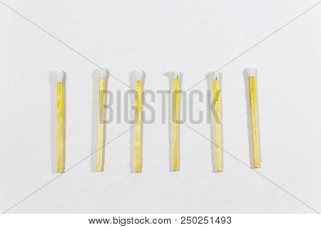 Upper Close-up Shot Of Orderly Positioned Multiple White Match Head Covered Matches