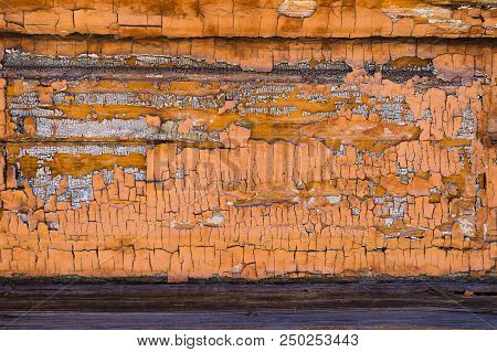 Old Boards With Cracked Rusty Paint. Textured Wooden Old Background With Vertical Lines.