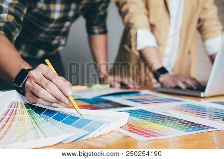 Young Creative Team Having A Meeting In Creative Office, Architectural Drawing With Work Tools And A
