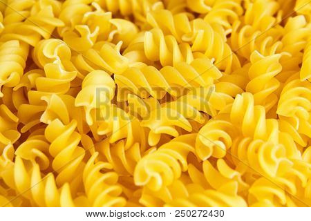 Raw Uncooked Dry Italian Fusilli Pasta. Corkscrew Spiral Shape