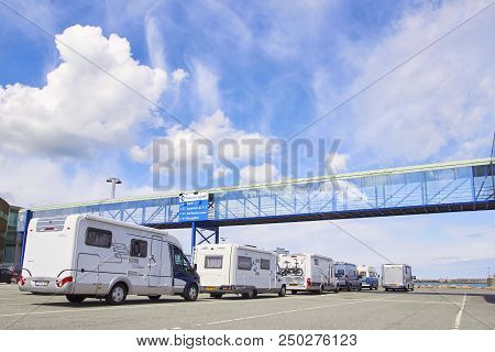 Denmark, Hirtshals- June 05, 2013: White Tourist Buses Traffic Jam On Speedway, Travel Time