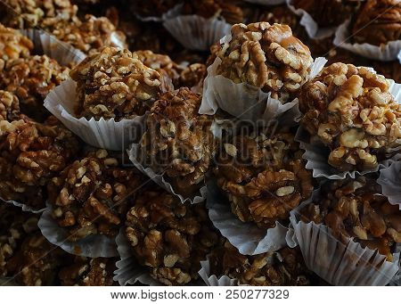 Picture Of Tasty Individually Wrapped Chewy Walnut Bites Ready For You To Eat.