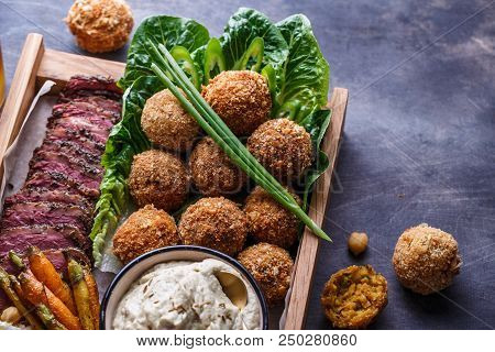 Close View Of Falafel, Babaghanoush And Pastrami In The Wooden Box, Copyspace