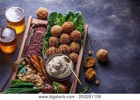 Close View Of Falafel, Babaghanoush And Pastrami In The Wooden Box, Copyspace
