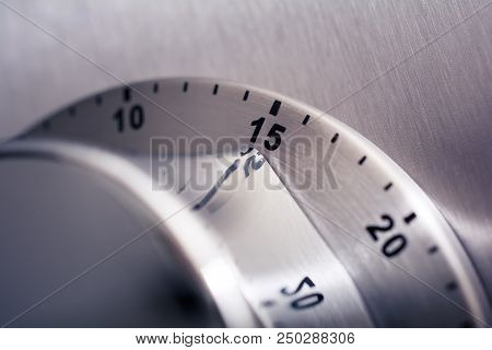 15 Minutes - An Analog Chrome Kitchen Timer Placed On A Refrigerator