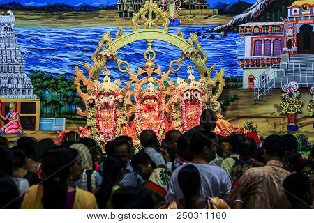 Durgapur, West Bengal, India. July 2018. Disciples And Devotees Crowding In Front Of Idols Of Jagann