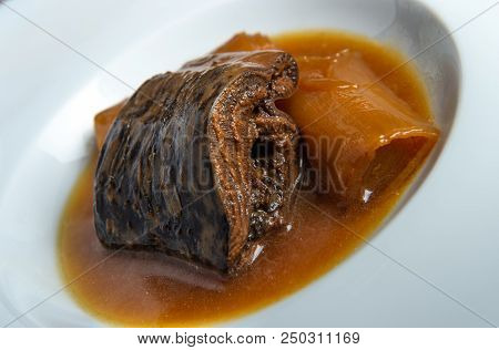 Lamprey With Bordeaux Sauce With Croutons And Leeks