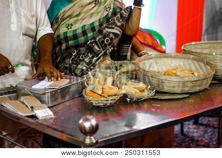 Holy Sweet Mahaprasad Being Displayed At A Counter On A Tale For Sale.
