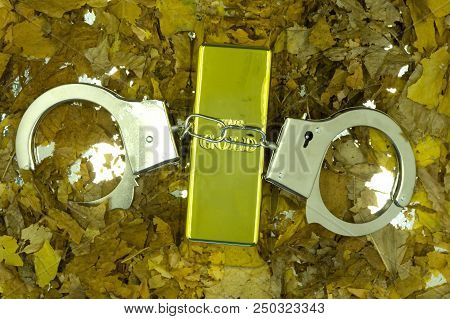 Handcuffs Golden Brick On White Background Drink