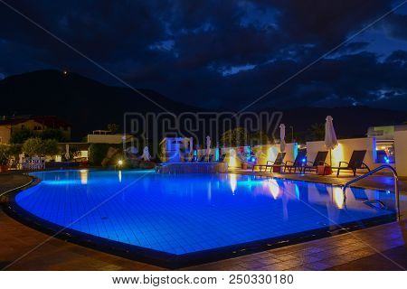 Swimming Pool At A Luxury Resort By Night In Lana