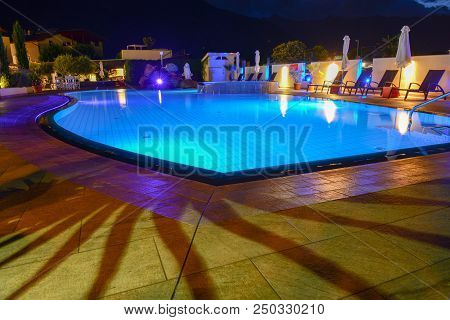 Swimming Pool At A Luxury Resort By Night In Lana