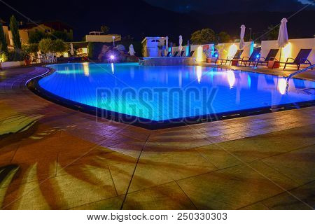 Swimming Pool At A Luxury Resort By Night In Lana